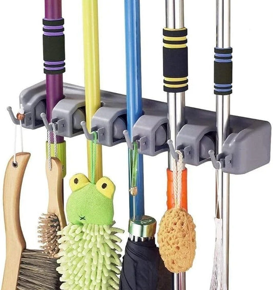 Wall-mounted broom and mop organizer